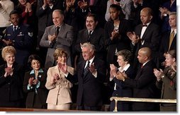 Mrs. Bush applauds her special guest, Dr. Adnan Pachachi, President of the Iraqi Governing Council, during President Bush's State of the Union Address at the U.S. Capitol Tuesday, Jan. 20, 2004. "Sir, America stands with you and the Iraqi people as you build a free and peaceful nation," said the President in his acknowledgement of Dr. Pachachi.  White House photo by Paul Morse