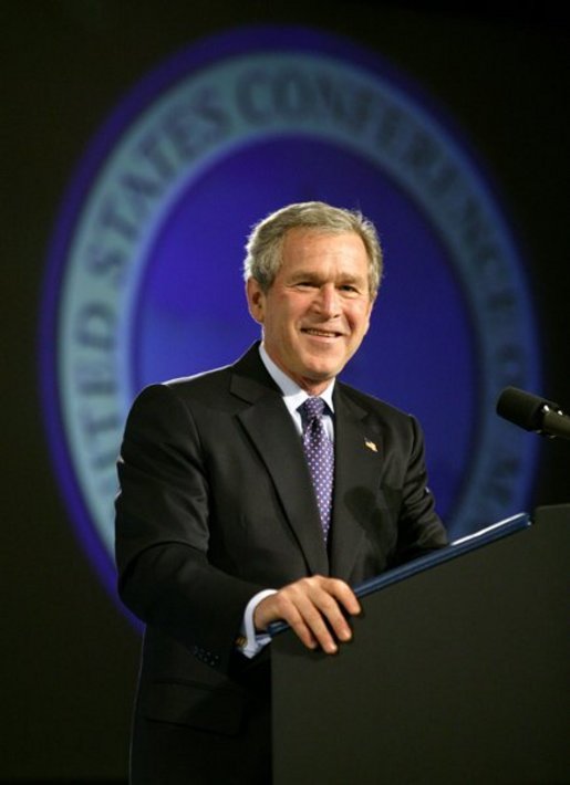President George W. Bush reacts during his introduction at the United States Conference of Mayors in Washington, D.C., Friday, Jan. 23, 2004. White House photo by Eric Draper