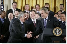 Shaking hands with manager Jack McKeon, President George W. Bush hosts a visit by the 2003 World Series Champions, the Florida Marlins, to the White House Friday, Jan. 23, 2004.  White House photo by Paul Morse