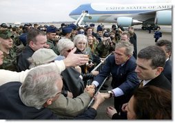President George W. Bush greets military personnel at Charleston Air Force Base before departing Charleston, S.C., Feb. 5, 2004.   White House photo by Paul Morse