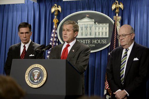 President George W. Bush holds a press briefing at the White House Friday, Feb. 6, 2004. "Today, by executive order, I am creating an independent commission, chaired by Governor and former Senator Chuck Robb (left), Judge Laurence Silberman (right), to look at American intelligence capabilities, especially our intelligence about weapons of mass destruction," said the President. White House photo by Paul Morse