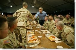 President George W. Bush greets national guardsmen as he joins them for lunch at Fort Polk, La., Tuesday, Feb. 17, 2004.  White House photo by Paul Morse