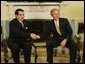 President George W. Bush meets with Tunisian President Zine Al-Abidine Ben Ali in the Oval Office Wednesday, February 18, 2004.  White House photo by Paul Morse
