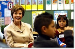Laura Bush participates in a reading lab with third and fourth graders at Limerick Elementary school in Los Angeles, California, Wednesday, February 18, 2004. "We know that if children don't learn to read by the end of the 3rd grade or 4th grade, their chances for learning to read decrease every year, and by the time they get to high school they're often the ones who drop out because of frustration that they -- over not being able to read," said Mrs. Bush during her visit to Limerick Elementary.  White House photo by Tina Hager
