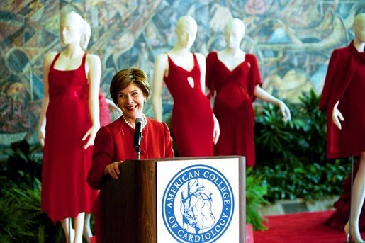 Laura Bush visits the Red Dress Project Exhibit and delivers remarks to the media after accepting the 2004 Colleges of Cardiology's Honorary Fellowship in New Orleans, Louisiana. " If we can encourage women to take charge of their health and the health of their families, we can do the same for heart disease. With the many risk factors for heart disease, a woman's greatest risk is ignorance. So I encourage all of you to pull out your favorite red tie or red dress and tell every woman and physician that you know that heart disease doesn't care what you wear." Monday, March 8, 2004. White House photo by Tina Hager