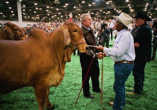 President George W. Bush greets a participant at the Houston Livestock Show and Rodeo Monday, March 8, 2004. White House photo by Eric Draper