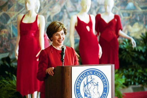 Laura Bush makes remarks during her tour of the Red Dress Project exhibit at the New Orleans Convention Center March 8, 2004. White House photo by Tina Hager
