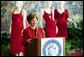 Laura Bush makes remarks during her tour of the Red Dress Project exhibit at the New Orleans Convention Center March 8, 2004. White House photo by Tina Hager