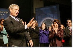 President George W. Bush reacts to the applause of the crowd before speaking at the Women's Entrepreneurship in the 21st Century Forum in Cleveland, Ohio, Wednesday, March 10, 2004.   White House photo by Paul Morse