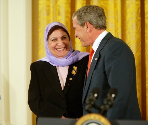 President George W. Bush greets Dr. Raja Habib Khuzai of the Iraqi Governing Council after delivering remarks on Women’s Human Rights in the East Room of the White House Fridy, March 12, 2004. White House photo by Paul Morse.