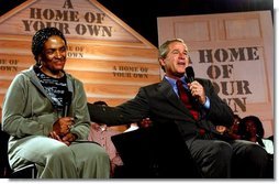 President George W. Bush speaks during a discussion about homeownership with first-time homebuyer Pearl Cerdan in Ardmore, Pennsylvania. Monday, March 15, 2004.  White House photo by Tina Hager