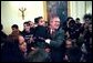 President George W. Bush hugs Kiera Williams, 4, of Spokane, Wash., during a photo shoot with the Children’s Miracle Network Champions Across America Representatives in the East Room of the White House Monday, March 22, 2004. The Champions are children who have battled a wide range of challenges, including birth defects, cancer and life-threatening illnesses. They now serve as ambassadors for the network. White House photo by Tina Hager.
