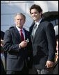 President George W. Bush greets Matt Leinart of University of Southern California's football team during a visit by the 2003 Fall NCAA Championship teams on the South Lawn March 23, 2004. In attendance were the University of Southern California's football and women's volleyball teams, the University of North Carolina women's soccer team, Louisiana State University football team and Indiana University men's soccer team. White House photo by Paul Morse.