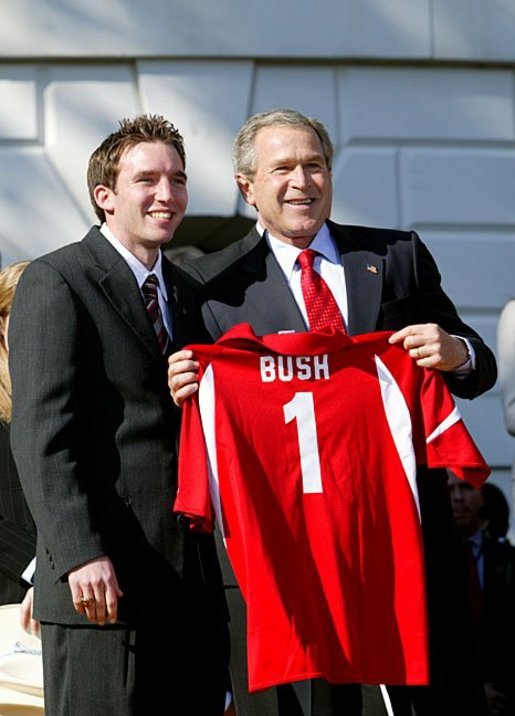 President George W. Bush greets Drew Shinaberger of Indiana University's men's soccer team during a visit by the 2003 Fall NCAA Championship teams on the South Lawn March 23, 2004. In attendance were the University of Southern California's football and women's volleyball teams, the University of North Carolina women's soccer team, Louisiana State University football team and Indiana University men's soccer team. White House photo by Paul Morse.