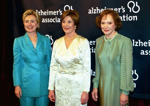 Accompanied by former first ladies Sen. Hillary Rodham Clinton, left, and Rosalynn Carter, Laura Bush attends the inaugural gala for the Alzheimer's Association in Washington, D.C., Wednesday, March 24, 2004. "I know how hard it is to lose someone to Alzheimer's disease. I lost my father seven years ago, so this subject is never far from my heart," said Mrs. Bush in her remarks. White House photo by Tina Hager