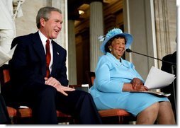 President George W. Bush listens during a Congressional Gold Medal ceremony honoring Dr. Dorothy Height for a lifetime of civil rights work in the U.S. Capitol Rotunda Wednesday, March 24, 2004.  White House photo by Paul Morse.