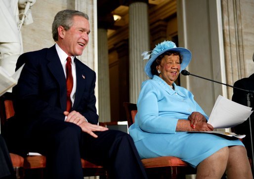 President George W. Bush listens during a Congressional Gold Medal ceremony honoring Dr. Dorothy Height for a lifetime of civil rights work in the U.S. Capitol Rotunda Wednesday, March 24, 2004. White House photo by Paul Morse.