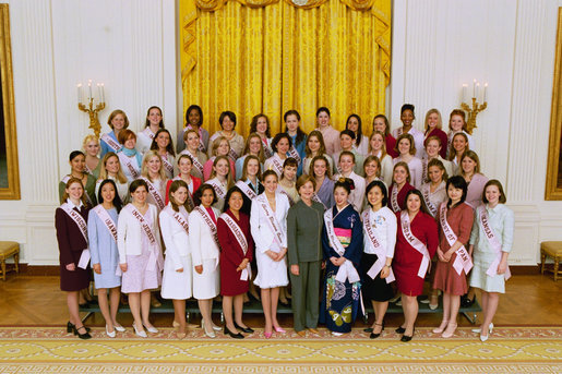 Mrs. Laura Bush poses with the 2004 Cherry Blossom Princesses in the East Room Wednesday, March 31, 2004. White House photo by Paul Morse