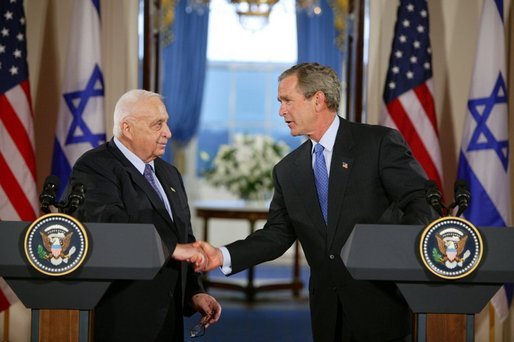 President George W. Bush and Israeli Prime Minister Ariel Sharon during a press conference in the Cross Hall of the White House on April 14, 2004. White House photo by Paul Morse.