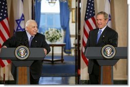 President George W. Bush and Israeli Prime Minister Ariel Sharon during a press conference in the Cross Hall of the White House on April 14, 2004.   White House photo by Paul Morse