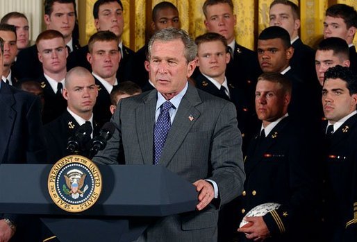 President George W. Bush speaks during the presentation of the Commander-In-Chief Trophy to the U.S. Naval Academy football team in the East Room Monday, April 19, 2004. The trophy is awarded to the Service Academy with the year's best overall record in NCAA football games versus the other academies. White House photo by Tina Hager.