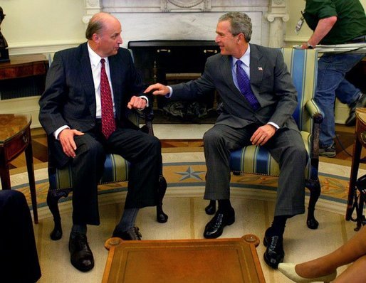 Announcing his intention to nominate him to be the U.S. Ambassador to Iraq, President George W. Bush talks with John Negroponte, who currently serves as the U.S. Ambassador to the United Nations, in the Oval Office Monday, April 19, 2004 White House photo by Eric Draper.