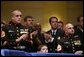 Local military and emergency first responders listen to President George W. Bush talk about the USA Patriot Act in Hershey, Pa., Monday, April 19, 2004. White House photo by Paul Morse.