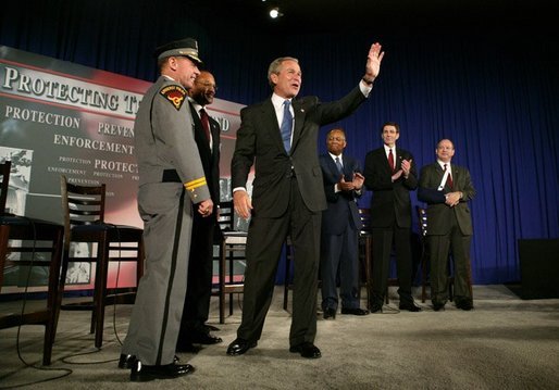 President George W. Bush waves to the audience during a conversation on the USA Patriot Act in Buffalo, N.Y., Tuesday, April 20, 2004. White House photo by Eric Draper.