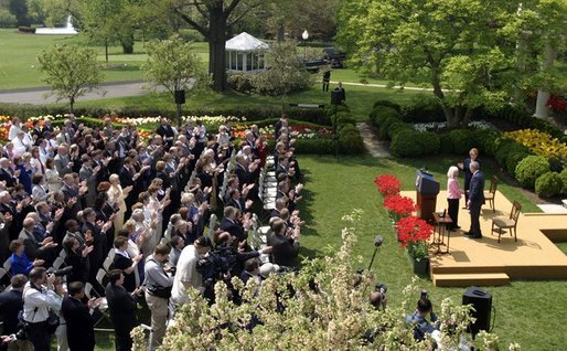 President George W. Bush and First Lady Mrs. Laura Bush with Kathleen Mellor the 2004 Teacher of the Year from South Kingstown, Rhode Island in the Rose Garden of the White House on April 21, 2004. White House photo by Paul Morse