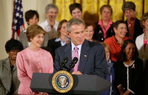 President George W. Bush gives remarks with First Lady Mrs. Laura Bush at a reception for the National Race for the Cure in the East Room of the White House on April 21, 2004. White House photo by Paul Morse