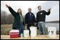President George W. Bush participates in a water testing project with Education Director Laura Lubelczyk, left, and volunteer Trak Lord at the Wells National Estuarine Research Reserve with in Wells, Maine, Thursday, April 22, 2004. In his remarks, President Bush discussed the value of volunteering in places like the reserve, "But what makes this beautiful part of the world go is the 400 volunteers who work here -- the 400 volunteers who are exercising their responsibility as citizens to make this beautiful part of the world even more beautiful and more meaningful." White House photo by Eric Draper.