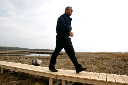 Commemorating Earth Day, President George W. Bush visits the Wells National Estuarine Research Reserve in Wells, Maine, Thursday, April 22, 2004. During his visit, President Bush announced a program to increase the amount of wetlands in the United States. "To do so, we will work to restore and to improve and to protect at least three million acres of wetlands over the next five years," said the President. White House photo by Eric Draper.