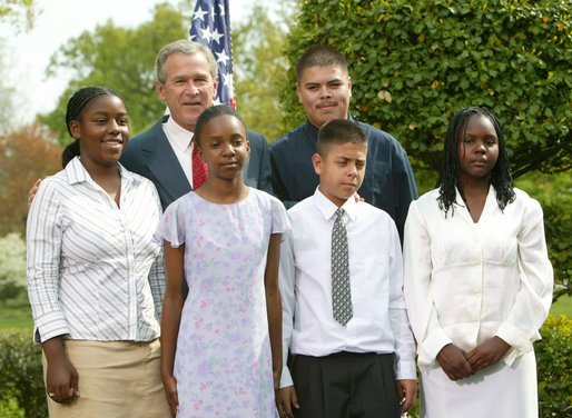 President George W. Bush congratulates Earth Walk of Denver, Colo., on receiving the President’s Environmental Youth Award in the East Garden April 22, 2004. White House photo by Susan Sterner.