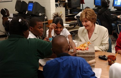 Laura Bush attends a class with middle school students during Mrs. Hatty Drew’s reading lab at the Snowden School in Memphis, Tenn. Friday, April 23, 2004. White House photo by Tina Hager.