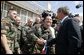 President George W. Bush greets base personnel of the 934th Airlift Wing of the Air National Guard at Minneapolis-St. Paul International Airport in Minneapolis, Minn., Monday, April 26, 2004. White House photo by Paul Morse.