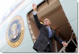 President George W. Bush waves to base personnel of the 934th Airlift Wing of the Air National Guard before departing Minneapolis-St. Paul International Airport in Minneapolis, Minnesota on April 26, 2004.   White House photo by Paul Morse