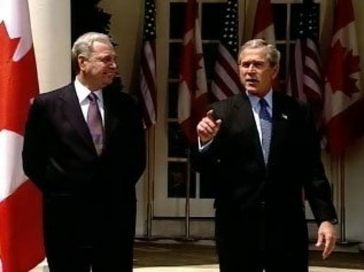 President Bush and Prime Minister Martin speak to reporters in the Rose Garden. White House screen capture.