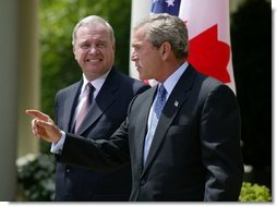 President George W. Bush and Canadian Prime Minister Paul Martin respond to questions from the press corps in the Rose Garden after a meeting at the White House on April 30, 2004.  White House photo by Paul Morse