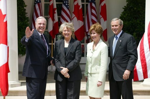 President George W. Bush and Mrs. Laura Bush with Canadian Prime Minister Paul Martin and his wife Sheila Martin after responding to questions from the press corps in the Rose Garden of the White House on April 30, 2004. White House photo by Paul Morse