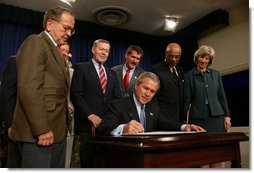 President George W. Bush signs into effect the Indian Education Executive Order in Room 450 of the Old Executive Building on April 30, 2004.  White House photo by Paul Morse
