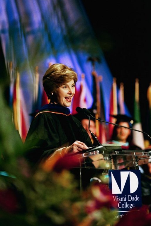 Laura Bush addresses the graduates of Miami Dade College in Miami, Fla., Saturday, May 1, 2004. "We're inspired by these stories of hope and progress. And I am inspired by each of your stories. Many commencement speakers try to give some grand life advice. But I don't have to do that for you. You are the advice I would give to others. But if you remember one thing, I hope it's this -- never cease to learn. Don't simply read books, devour them, and share them. In your wallet, put your library card before your credit card." White House photo by Tina Hager
