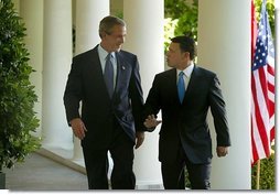 President George W. Bush and His Majesty King Abdullah Bin Al Hussein of Jordan walk together after holding a joint press conference in the Rose Garden Thursday, May 6, 2004.   White House photo by Paul Morse