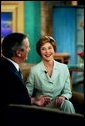 Laura Bush speaks with Charlie Gibson during a Good Morning America live interview at the ABC Studios in New York City, Monday, May 10, 2004. White House photo by Tina Hager