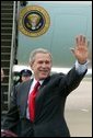 President George W. Bush waves to the crowd upon his arrival to Fort Smith, Ark., Tuesday, May 11, 2004. White House photo by Paul Morse