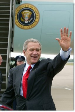 President George W. Bush waves to the crowd upon his arrival to Fort Smith, Ark., Tuesday, May 11, 2004.  White House photo by Paul Morse
