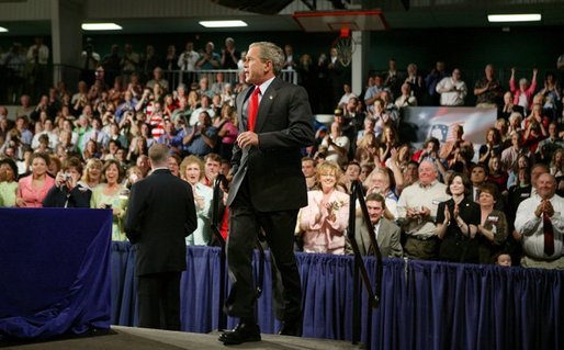 President George W. Bush walks on stage to deliver remarks on the No Child Left Behind Act at Butterfield Junior High School in Van Buren, Ark., Tuesday, May 11, 2004. "Under the new law, when children are falling behind, the schools that need the most attention get extra help, extra money, so the children can catch up," said the President in his remarks. White House photo by Paul Morse