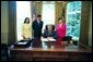 President George W. Bush signs an executive order creating the new President’s Advisory Commission on Asian Americans and Pacific Islanders. Pictured with the President are, from left, Susan Ralston, Executive Assistant to the Senior Advisor; Eddy Badrina, director, White House Initiative on Asian Americans and Pacific Islanders; and Chiling Tong, associate director, Office of Legislative, Education and Intergovernmental Affairs, Minority Business Development Agency. The new Commission will be housed at the Department of Commerce in the Minority Business Development Agency and will focus on providing equal economic opportunities for Asian American and Pacific Islander businesses where they may be underserved. White House photo by Eric Draper.