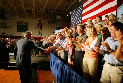 President George W. Bush greets the audience before participating in a conversation on High School Initiatives at Parkersburg South High School in Parkersburg, W. Va., Thursday, May 13, 2004. White House photo by Paul Morse
