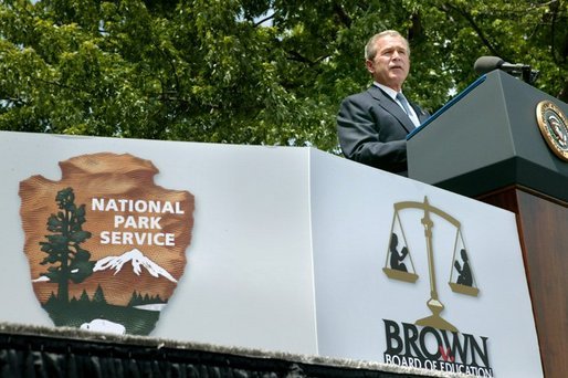 President George W. Bush talks about segregation during the 50th anniversary of Brown V. Board of Education at the national historic site named in its honor in Topeka, Kan., Monday, May 17, 2004. "The color of your skin determined where you could get your hair cut, which hospital ward you could be treated in, which park or library you could visit, or who you could go fishing with. And children were instructed early in the customs of racial division -- at schools where they never saw a face of another color," said the President. White House photo by Eric Draper.