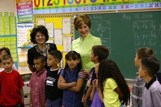 Laura Bush visits with students from Ms. Valdez's first grade reading class at Reginald Chavez Elementary School in Albuquerque, N.M., Thursday, May 20, 2004. In her remarks, Mrs. Bush discussed the Summer Reader's Achievement Program, "And the goal of it is to encourage children in kindergarten through eighth grade to read over the summer, which will mitigate the loss in reading skills that research shows takes place in students, especially low-income students who leave school in the spring and don't pick up a book all summer and then come back in the fall and they really have to start over again on a lot of their reading skills." White House photo by Tina Hager.